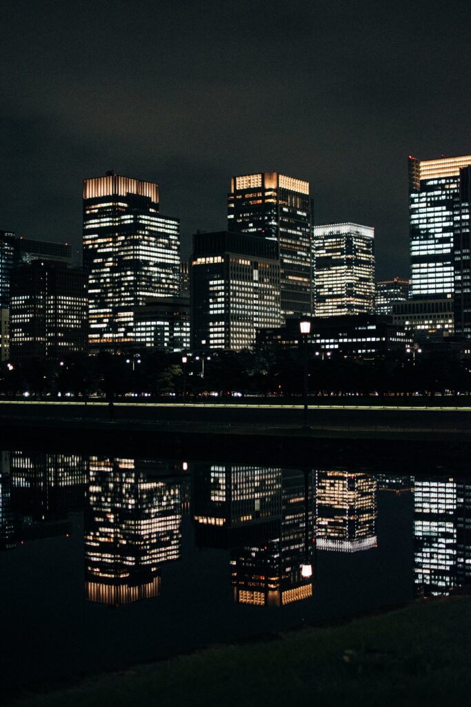 Captivating Night Cityscape Wallpaper: Modern Buildings Reflection