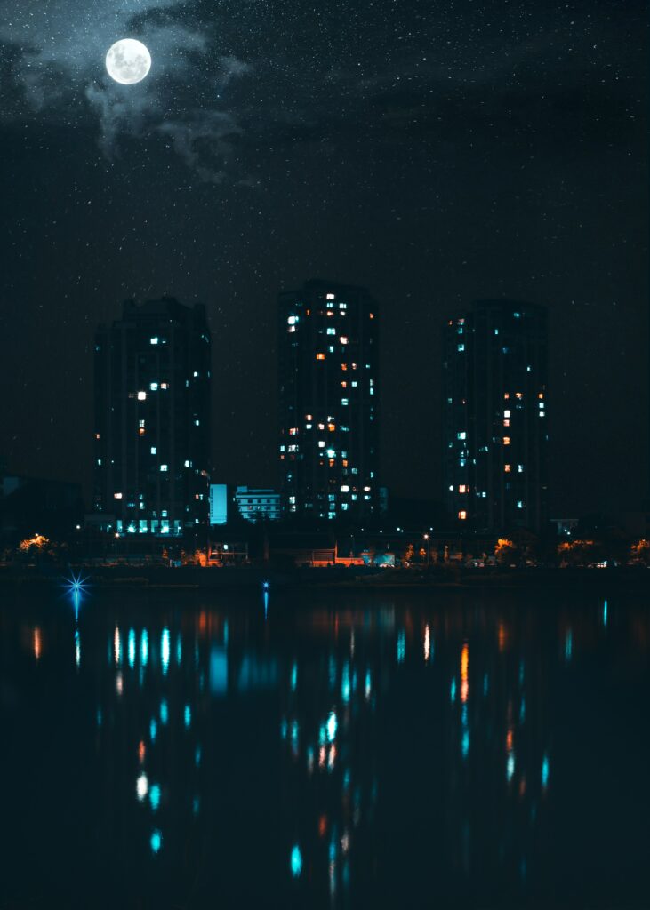 Serene Night Cityscape Wallpaper: Skyscrapers & Vibrant Lights