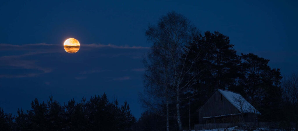 Serene Night Wallpaper: Full Moon Over House & Trees in Blue Sky