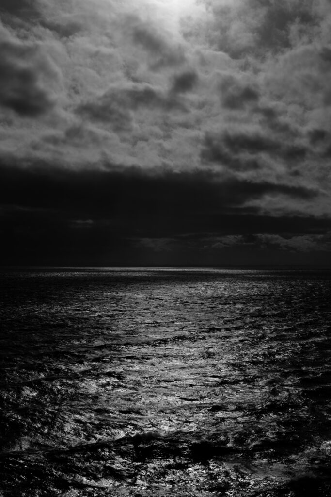 Serene Night Sea Wallpaper: Moonlit Waves & Mystical Clouds