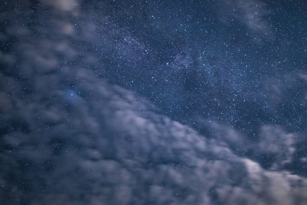 Serene Night Sky HD Wallpaper: Stars & Soft Clouds Background