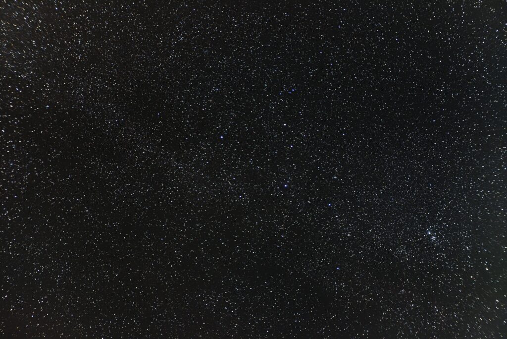 Serene Starry Night Sky Wallpaper Background for Mesmerizing Spaces