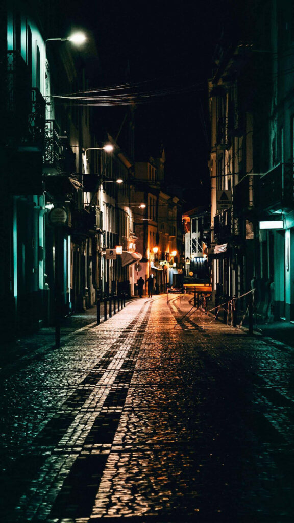 Serene Cobblestone Street at Night - Warm Light Wallpaper Background