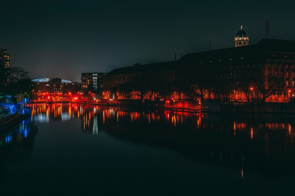 Serene Berlin Night View Wallpaper: City Lights & River Reflection