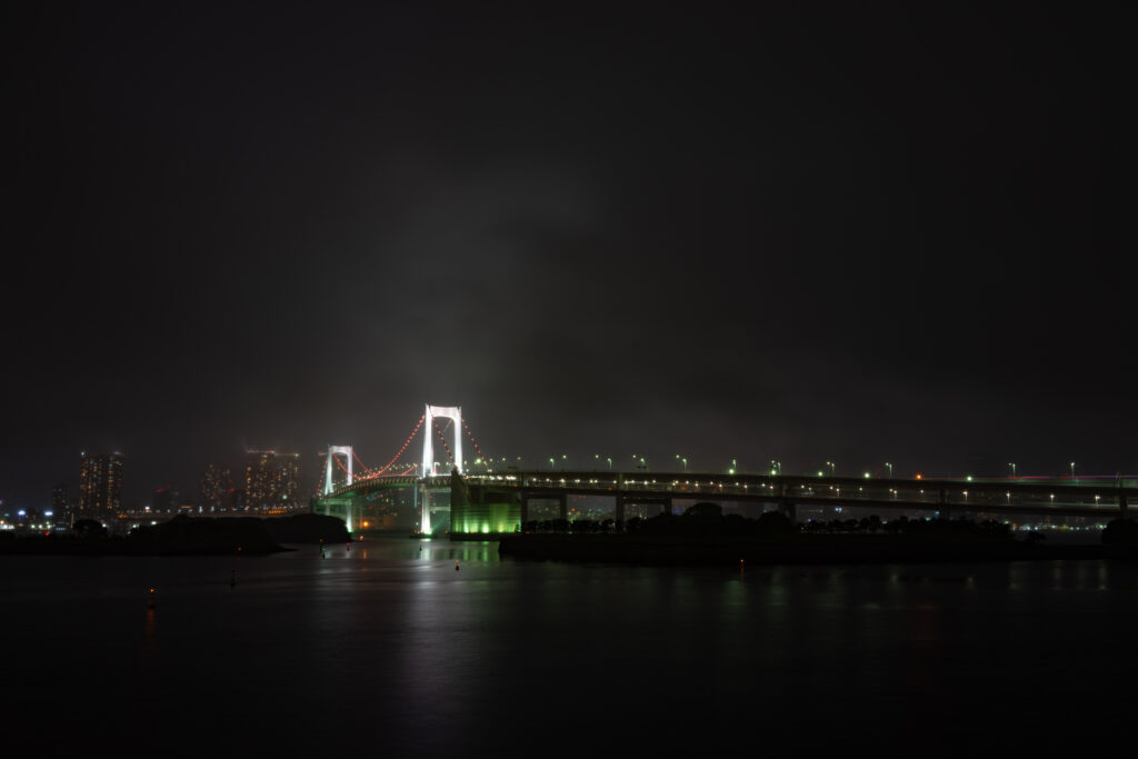 Serene Night Bridge Wallpaper: Luminous Foggy River Scene