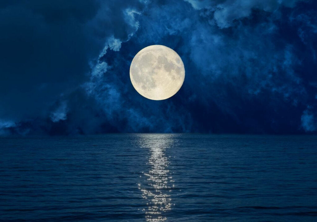 Serene Nightscape: Luminous Full Moon Over Calm Ocean Wallpaper