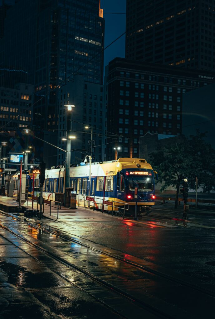 Serene Nighttime City Wallpaper: Metro Train & Glistening Rails