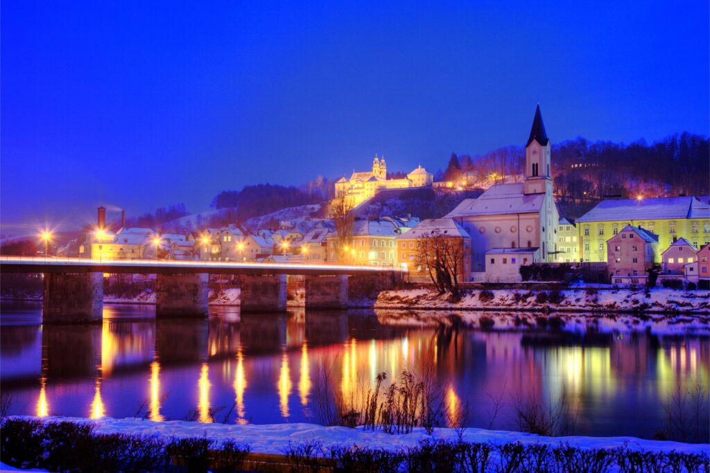 Serene Nighttime German City Wallpaper: Rivers, Lights & Snow