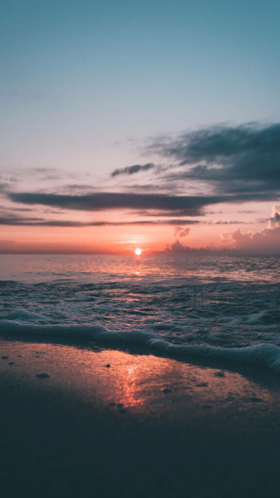 Serene Ocean Sunset Wallpaper: Soft Pinks & Deep Blues Background