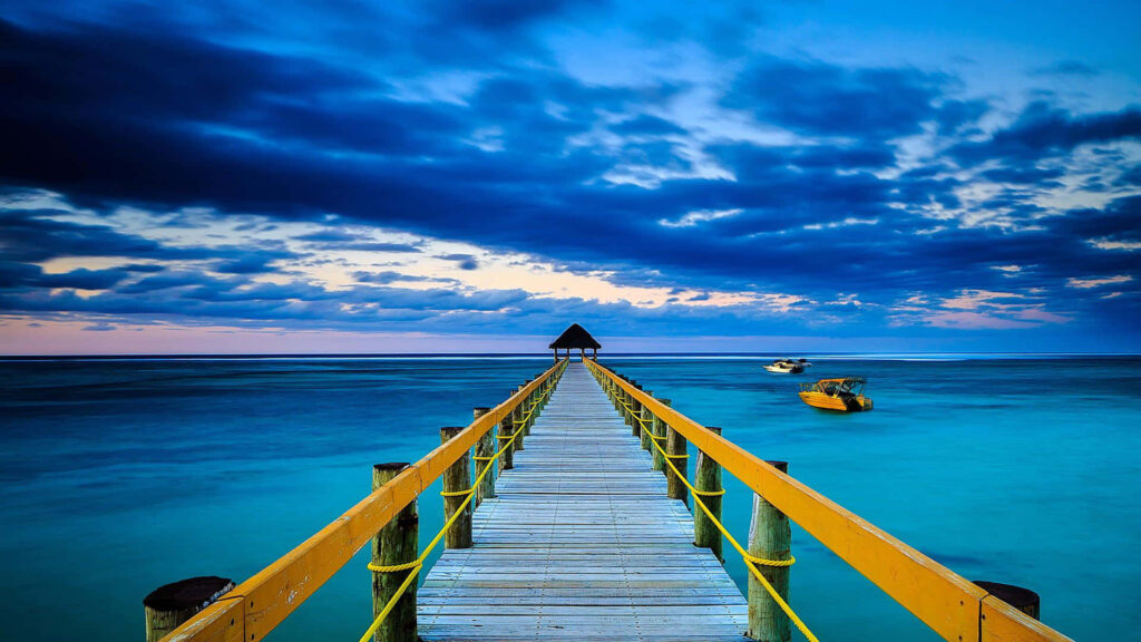 Tranquil Ocean View Wallpaper with Pier and Turquoise Waters