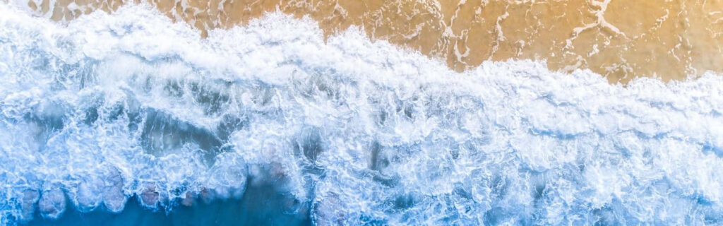 Serene Aerial Ocean Waves Wallpaper for Refreshing Laptop Background