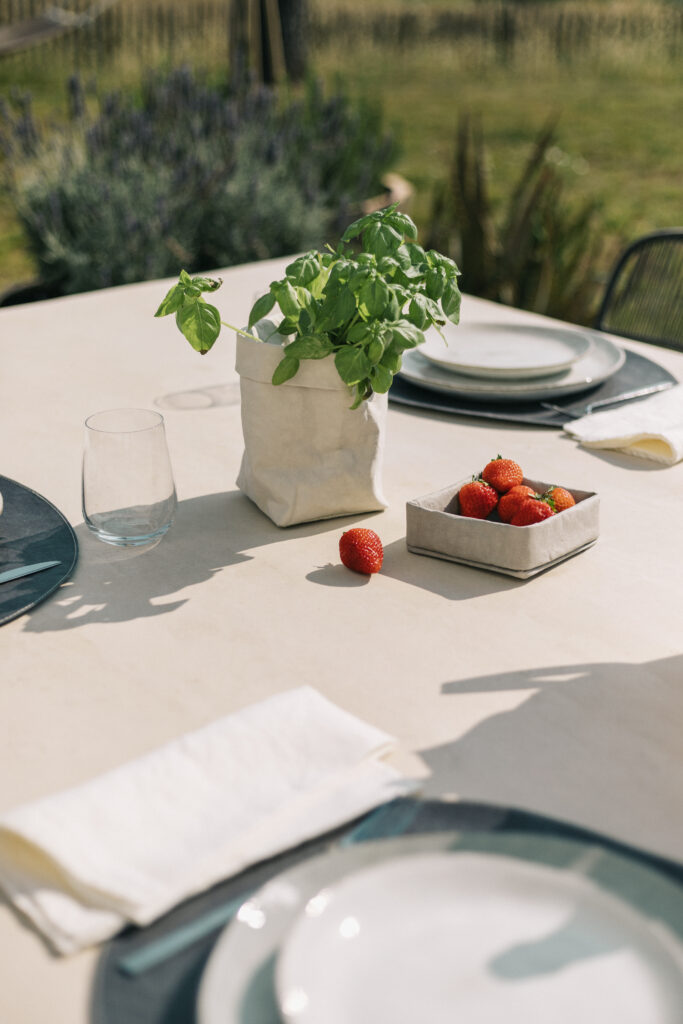 Serene Outdoor Table Setting with Strawberries & Basil | Aesthetic Wallpaper