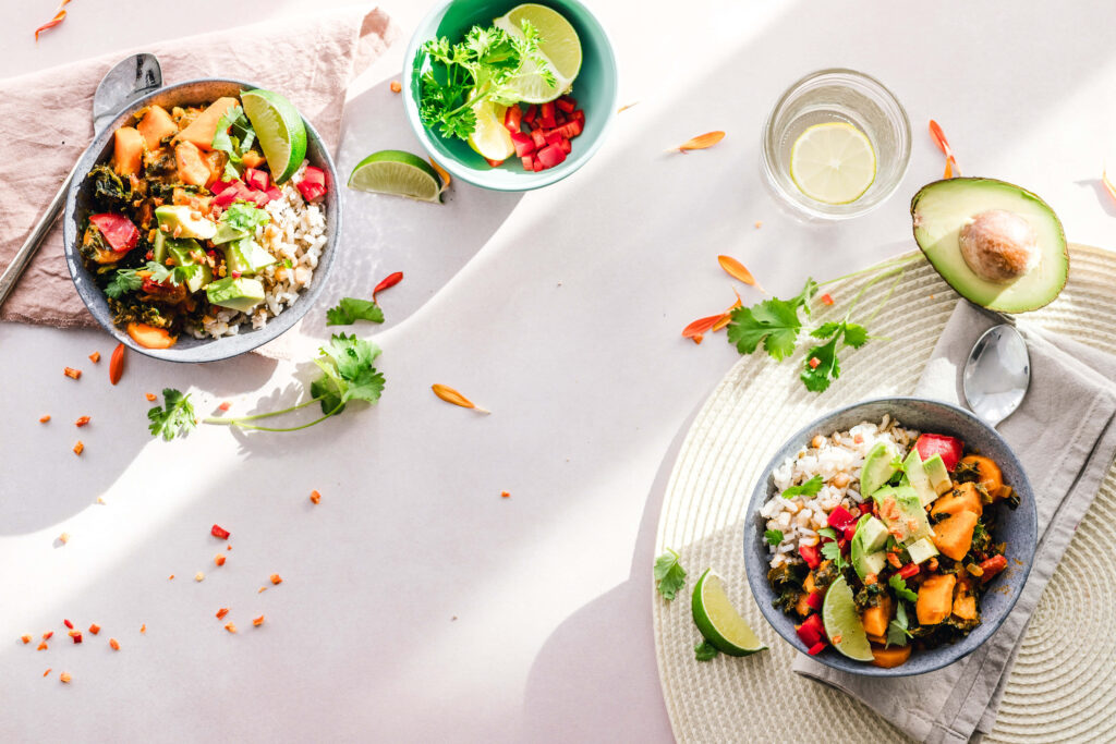 Serene Overhead View: Colorful Salad Bowls with Avocado & Lime Wallpaper