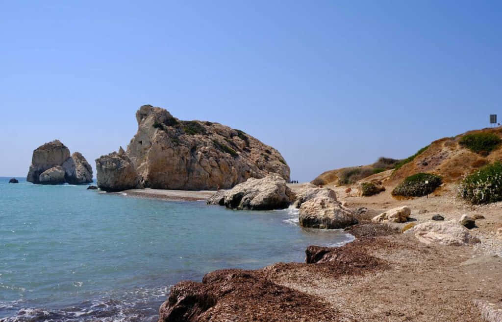 Serene Paphos Beach Wallpaper: Turquoise Sea & Rock Formations
