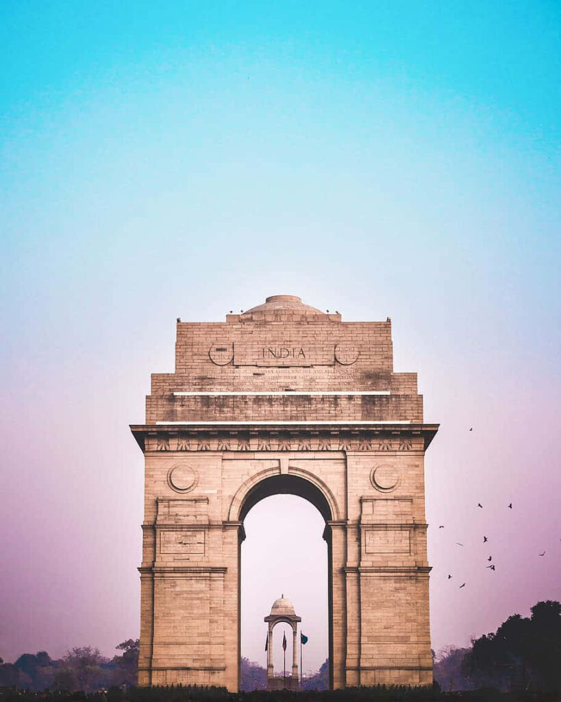Pastel Sky Over India Gate: Serene Wallpaper Background