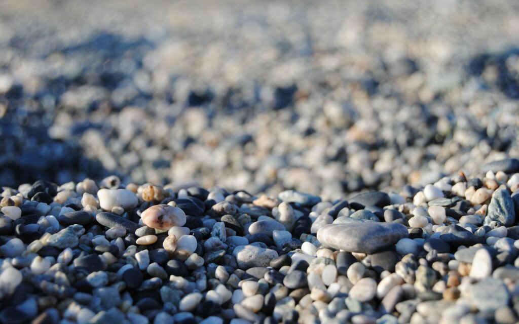 Calming Pebble and Sand Texture: Serene Wallpaper Background