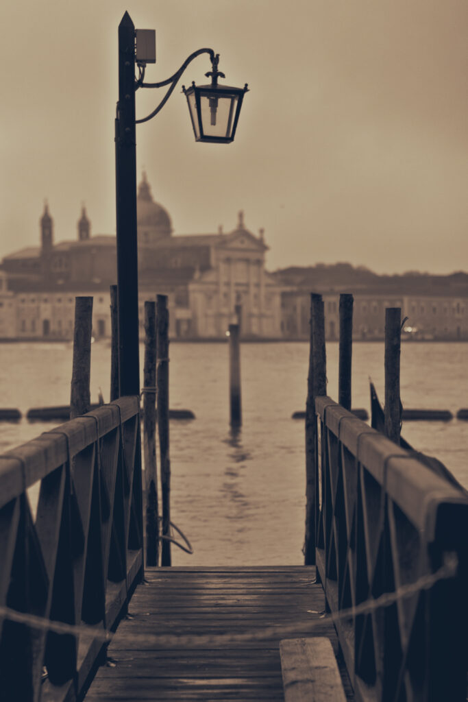 Vintage Serene Pier Wallpaper: Calm Waters & Historic Cityscape