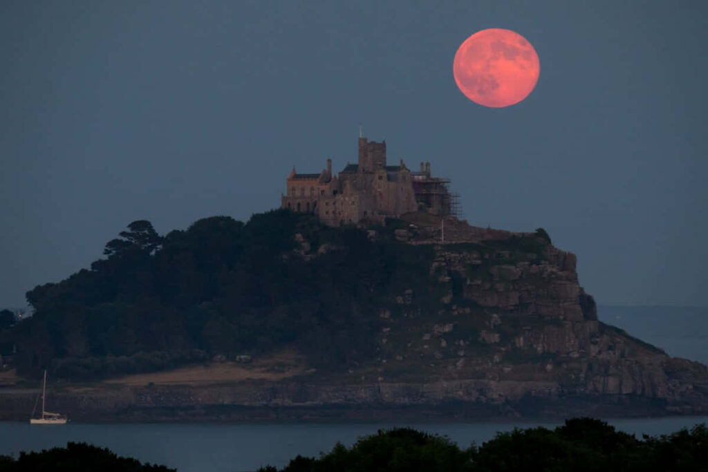 Vibrant Pink Moon Over Historic Castle - Serene Night Wallpaper
