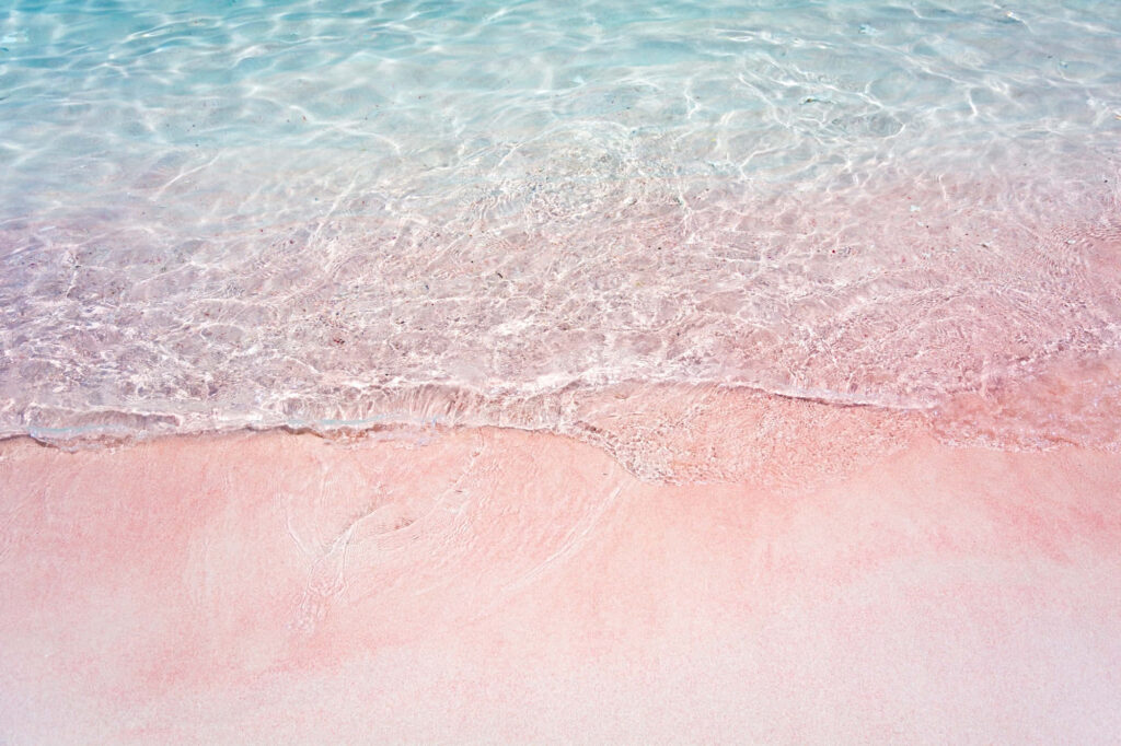 Serene Pink Sand Beach Wallpaper: Tranquil Pastel Background Art