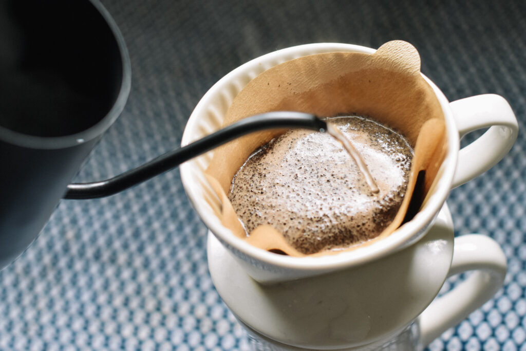 Serene Pour-Over Coffee Brewing: Close-Up Wallpaper Design