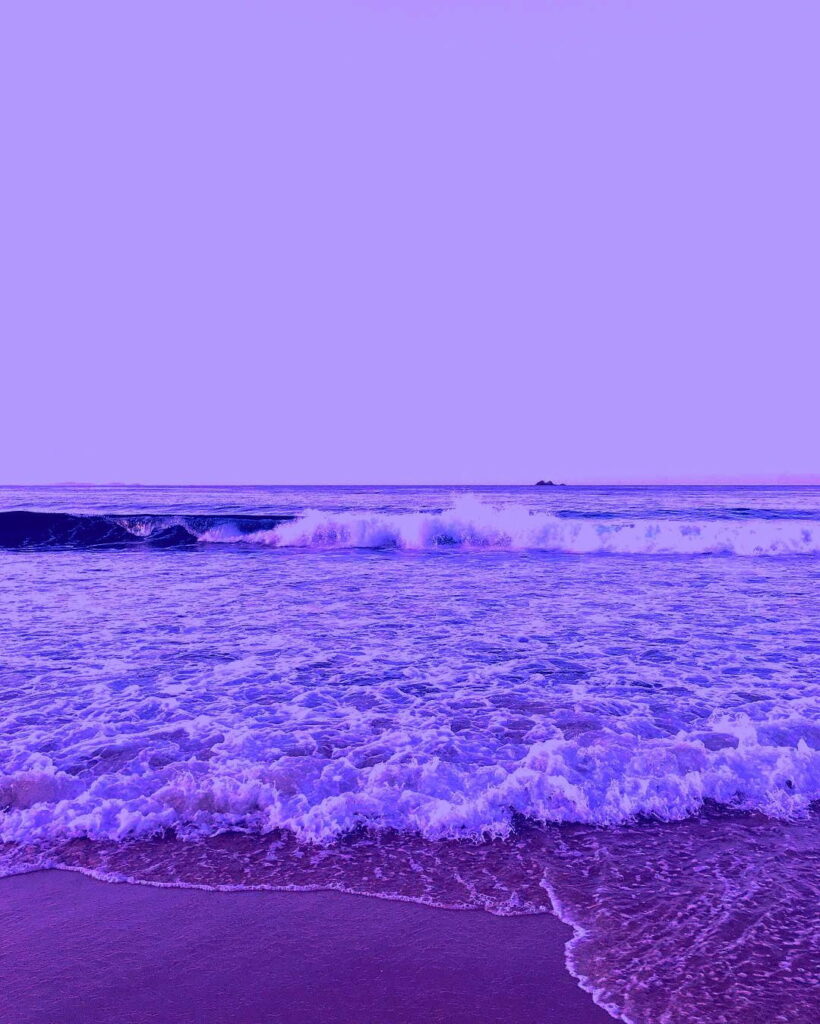 Ethereal Waves: Captivating Purple Beachscape, a Dreamy HD Wallpaper for Your Phone