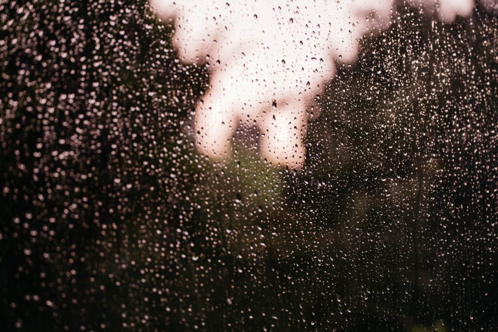 Macro Rain Droplets Wallpaper: Serene Glass Surface Background