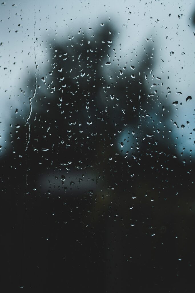 Serene Raindrops on Glass: Calm Macro Wallpaper Background