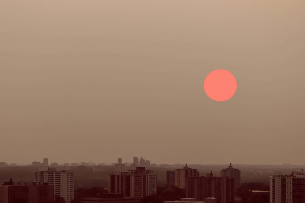 Calm Red Moon Wallpaper: Serene Cityscape Background Image