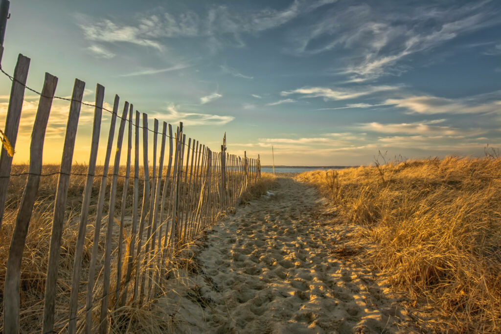 Tranquil Beach Wallpaper: Sunset, Wooden Fence & Sandy Path
