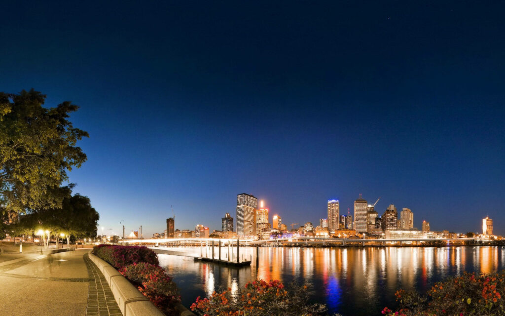 Serene Riverside Walkway at Night - Urban Landscape Wallpaper