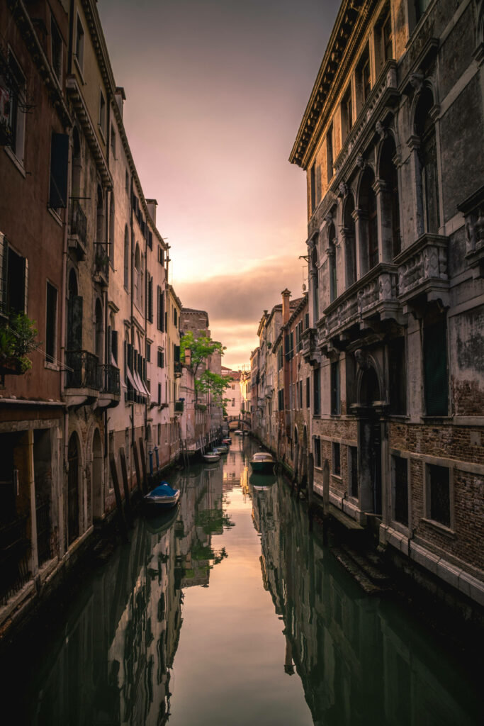 Serene Riverside Morning Wallpaper: Historic Architecture Reflection