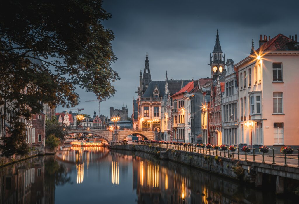 Charming Riverside Wallpaper: Historic Buildings & Serene Reflections