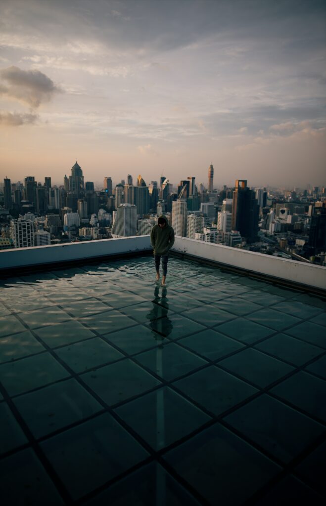 Serene Rooftop Reflection: Urban Skyline Wallpaper Background