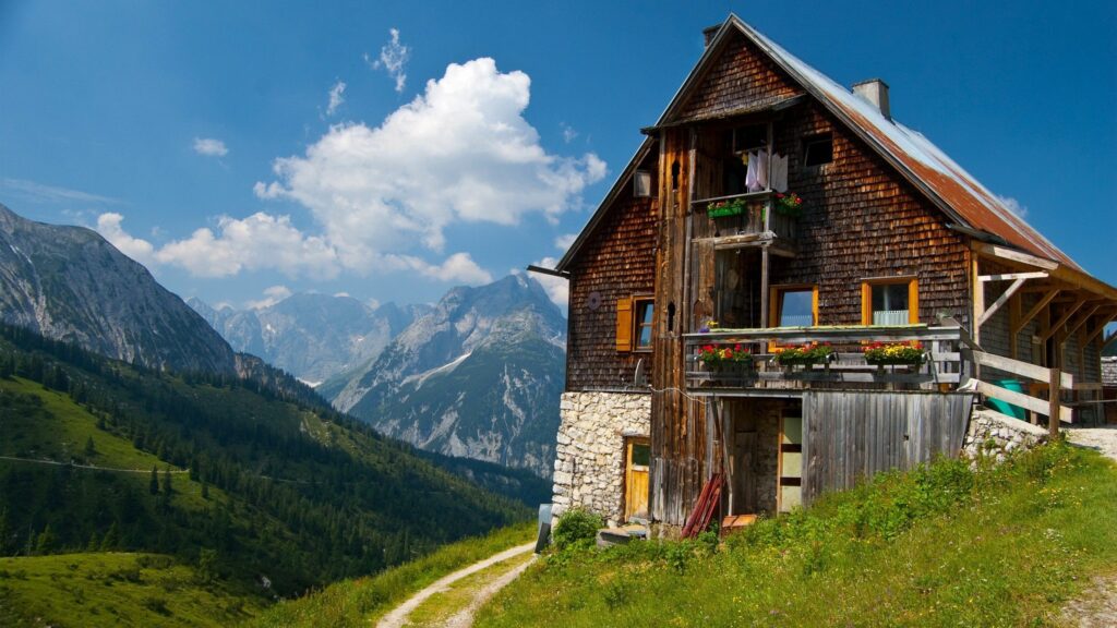 Charming Rustic Building Amid Lush Nature | Tranquil Wallpaper Background