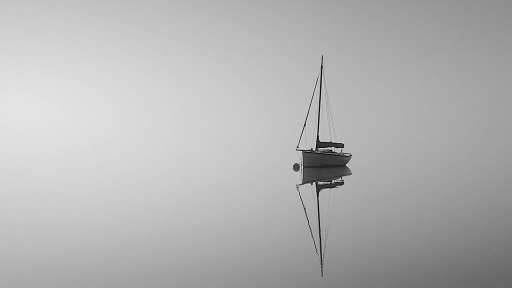Minimalist Monochrome Wallpaper: Serene Sailboat Reflection Background