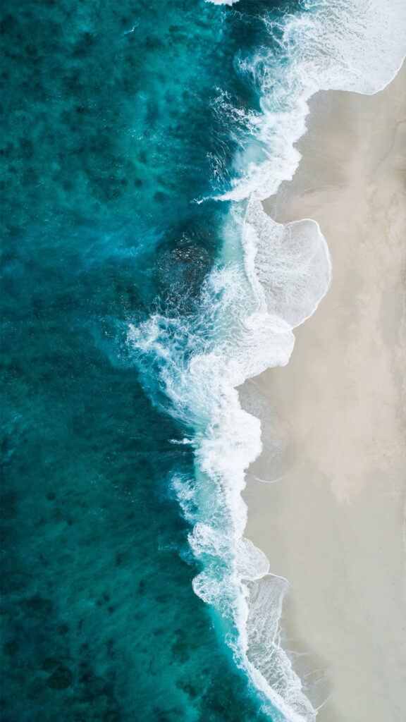 HD Seaside Bliss: Shifaaz Shamoon's Captivating Blue Ocean Wave - A Perfect Phone Wallpaper Background!