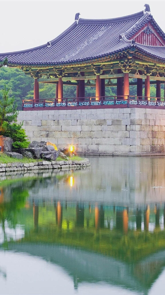Serene Seoul Morning: Traditional Architecture Reflected in Calm Waters Wallpaper