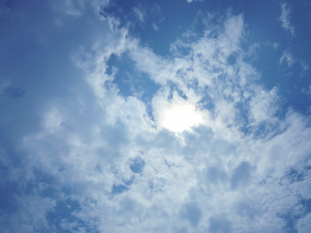 Serene Blue Sky with Fluffy Clouds - HD Wallpaper Background
