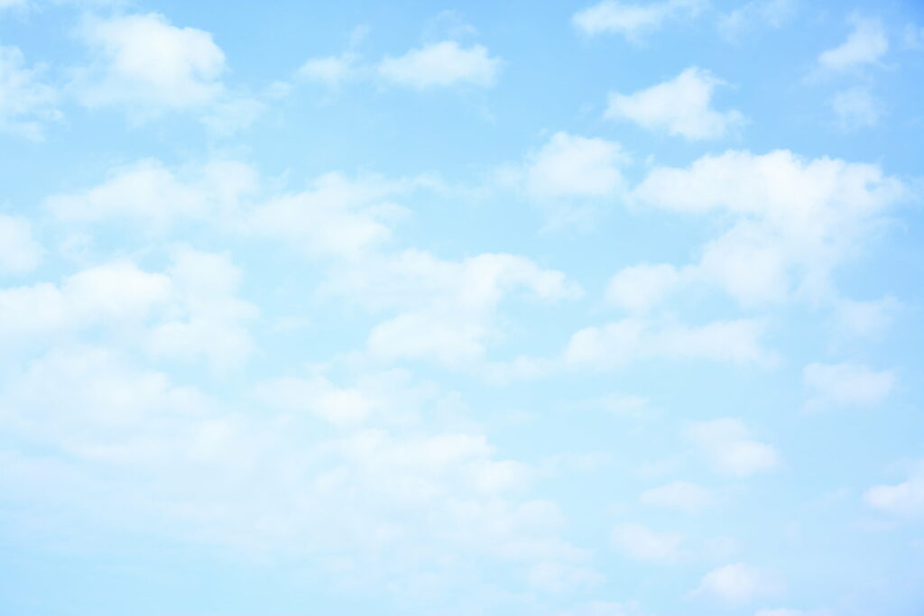 Serene Sky Wallpaper: Fluffy Clouds & Tranquil Blue Background