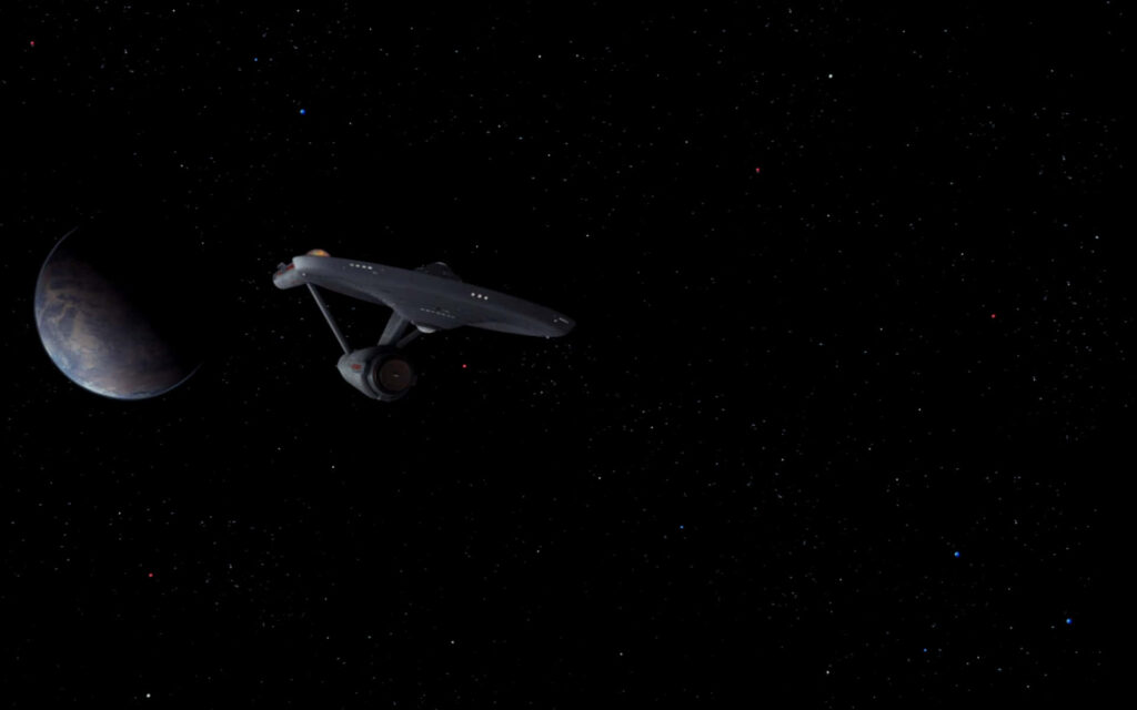 Classic Spacecraft Wallpaper: Serene Cosmic Scene with Distant Planet
