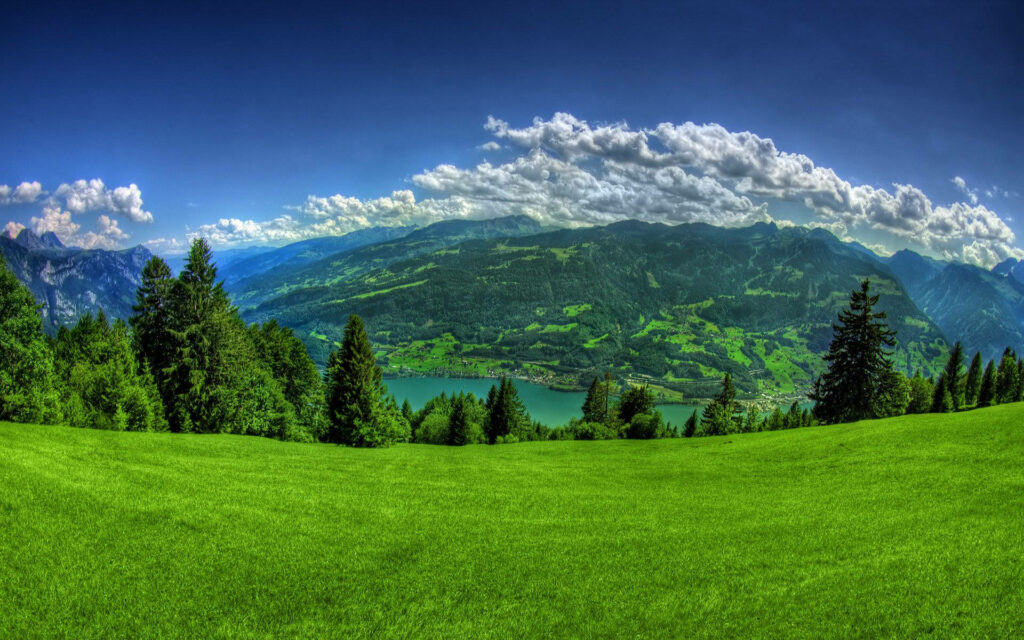 Nature's Serenity: Captivating Mountain Vista amidst Lush Greenery Wallpaper