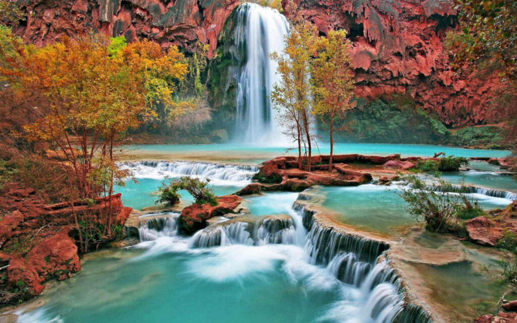 Enchanting Autumn Oasis: Mesmerizing Havasu Falls Embracing Turquoise Waters and Vibrant Trees - 4k Immersive Autumn Background Wallpaper