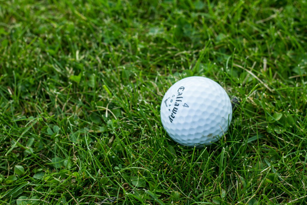 Swinging in the Green Oasis: A Serene Golf Course Escape Wallpaper
