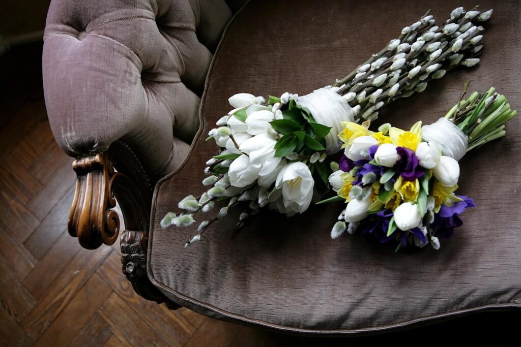 Timeless Charm: Elegant Spring Flowers on Vintage Chair Background Wallpaper