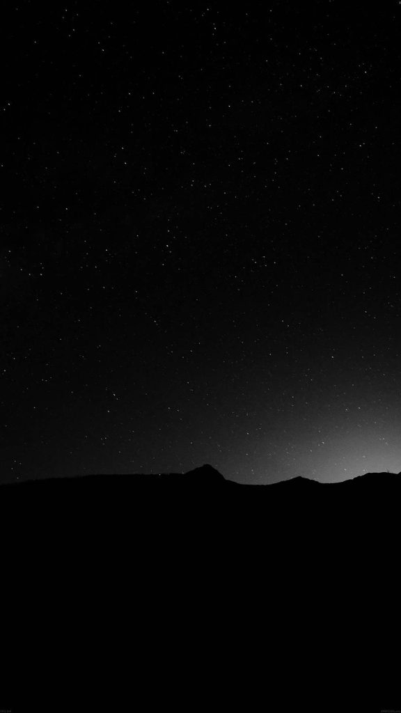 Pure black AMOLED wallpaper with minimalist mountain silhouette under starry night sky background