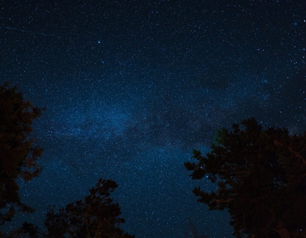 Breathtaking Starry Night Wallpaper: Deep Blue Tranquil Background