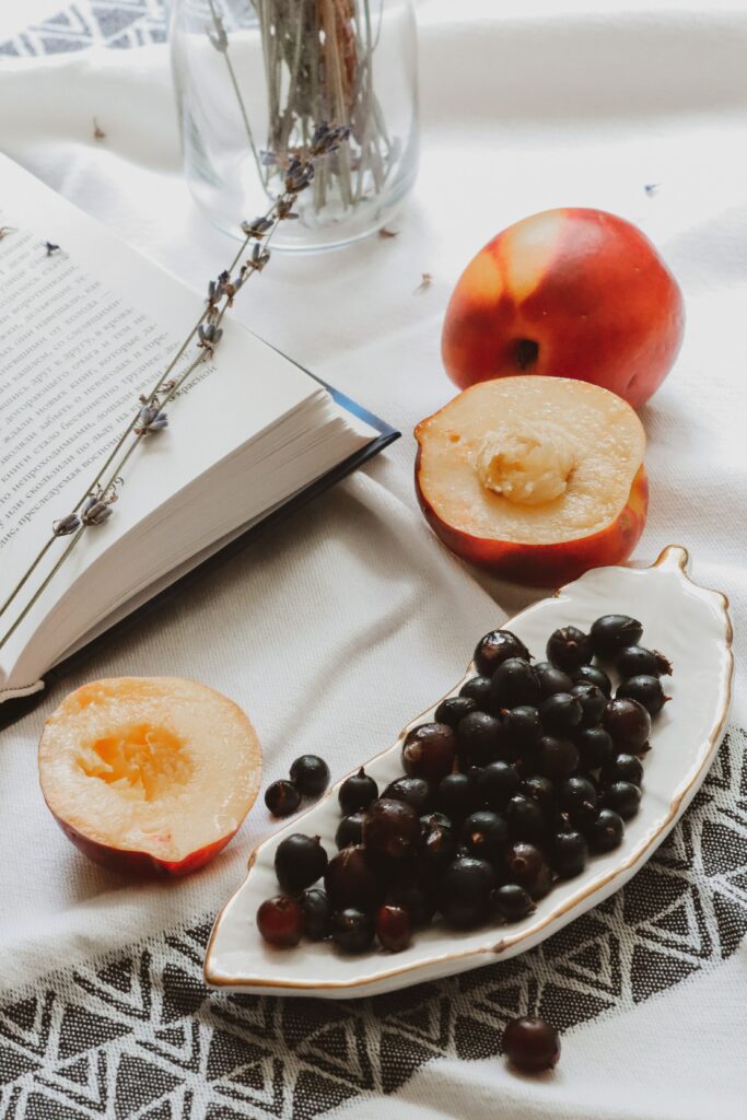 Serene Still Life: Peach, Currants, Book & Lavender on Fabric Wallpaper