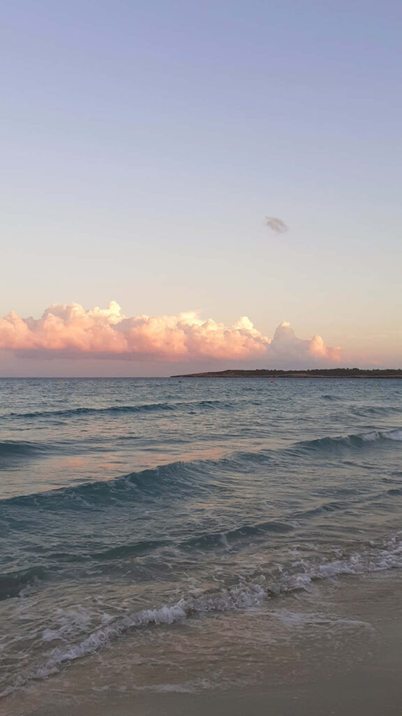 Tranquil Sunset Beachscape Wallpaper: Peaceful Pastel Background