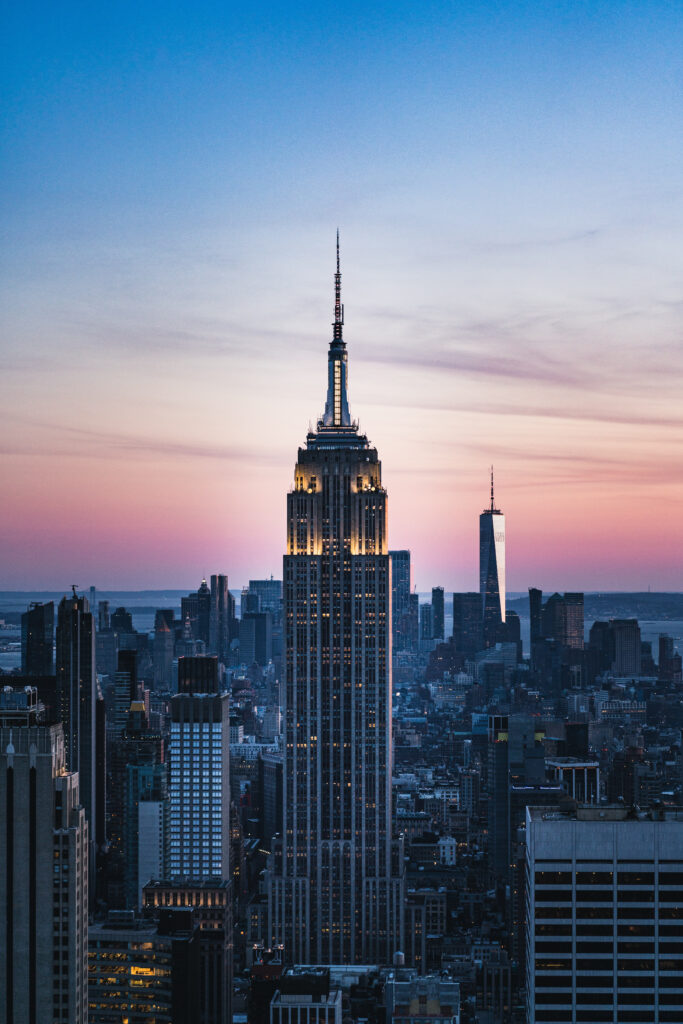 Stunning Sunset Cityscape Wallpaper with Towering Skyscrapers