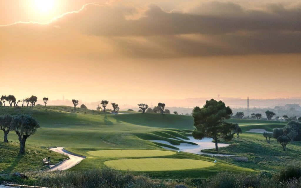 Serene Golf Course Sunset Wallpaper: Tranquil Green Landscape Background